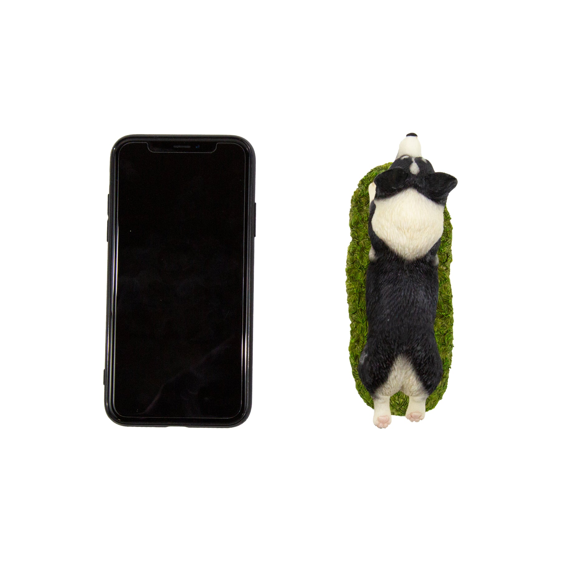 Flying Corgi Figurine next to cellphone for size comparison