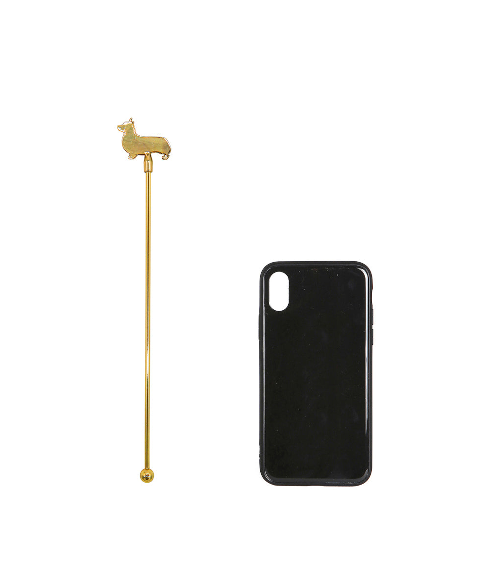 Gold Corgi Stir Stick next to cellphone for size comparison