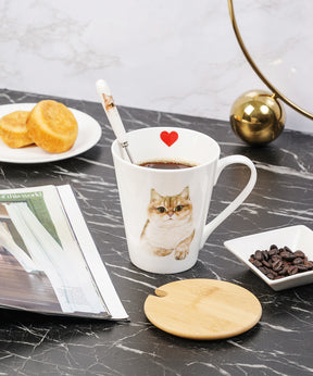 Pet Portrait Porcelain Water Cup with Lid & Spoon - British Shorthair(Golden) on table