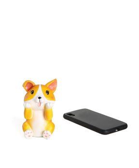 Corgi Figurine Glasses Holder next to cellphone for size comparison