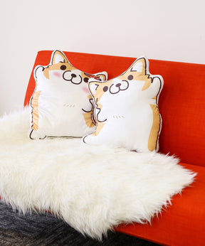 Dancing Corgi Pillows on couch