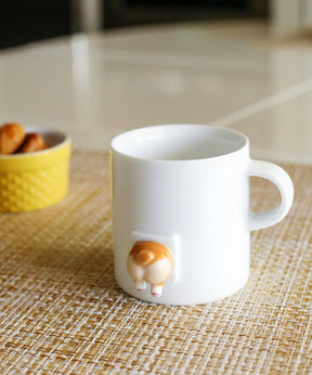 Handmade 3D Corgi Butt Mug on table 