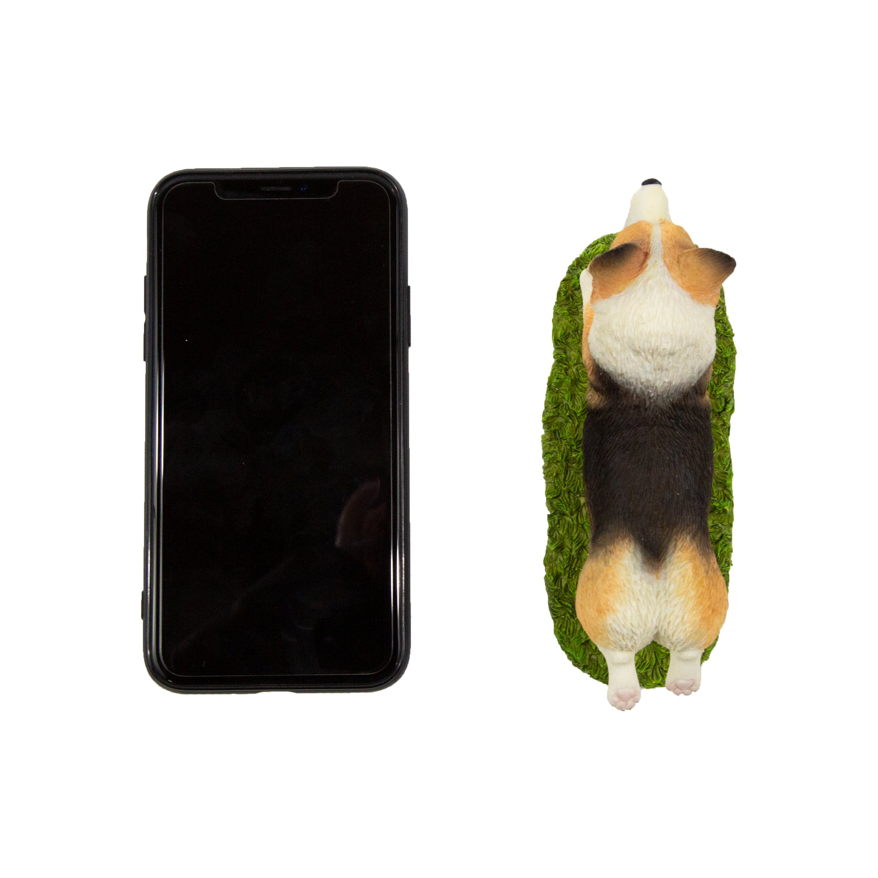 Flying Corgi Figurine next to cellphone for size comparison