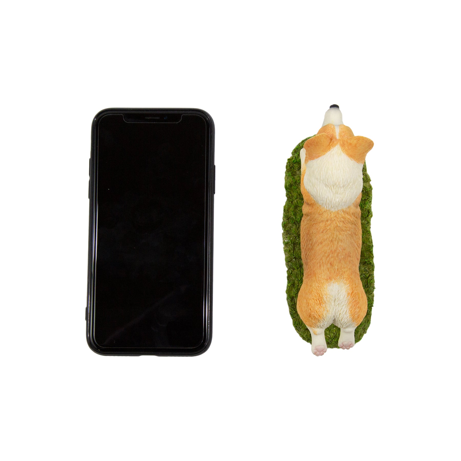Flying Corgi Figurine next to cellphone for size comparison