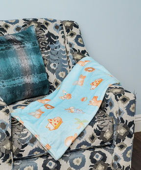 Super Soft Corgi Fleece Blanket on couch