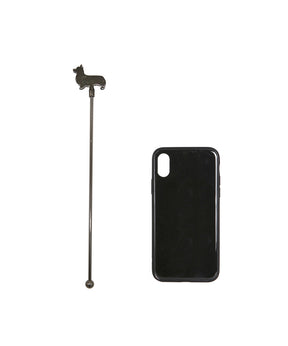 Black Corgi Stir Stick next to cellphone for size comparison