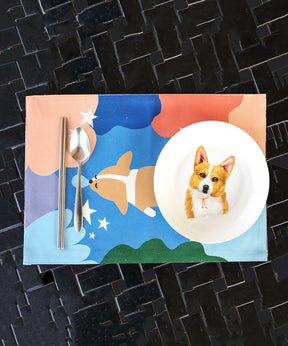 Blue Corgi Placemat with dinnerware on top