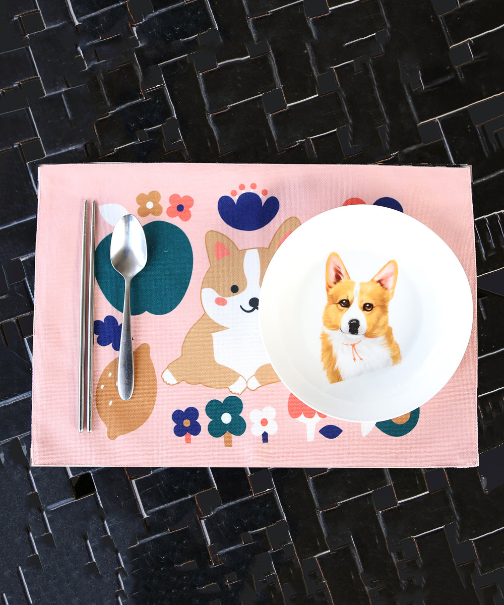 Pink Corgi Placemat with dinnerware on top
