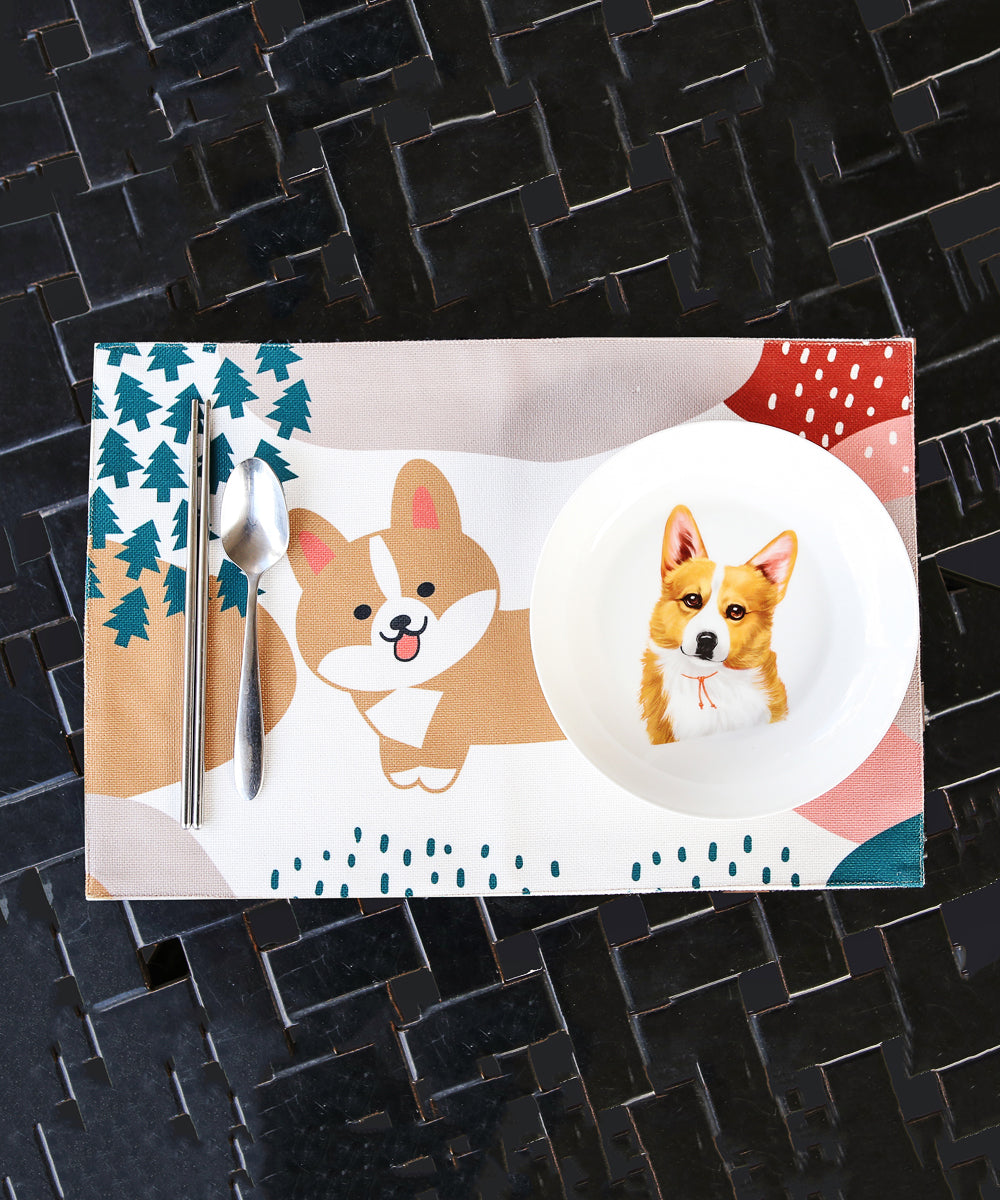 White Corgi Placemat with dinnerware on top